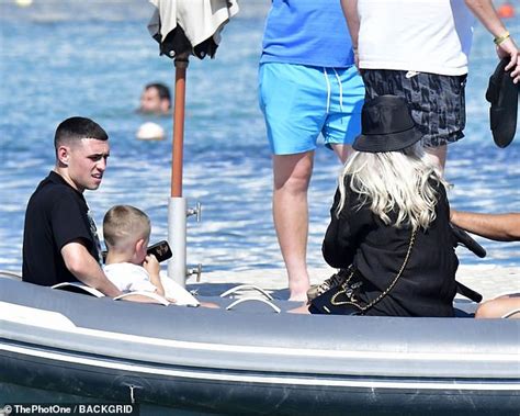 Shirtless Phil Foden soaks up the sun with his bikini